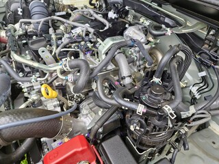 Car fuel pump head. Close-up of fuel pump head and engine parts in the engine compartment of a truck. Selective focus