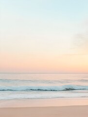 Fototapeta premium Serene Sunrise Over Tranquil Beach with Gentle Waves and Warm Sky