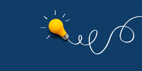 Brainstorming concept with a yellow light bulb - Flat lay