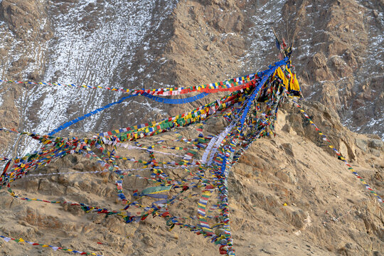 India, Ladakh, Leh. Prayer flags are found in the rocky outcroppings.