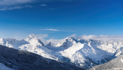 Wide angle view landscape of white snowy peak in mountain range with clear blue sky. Nature concept for lifestyle product background