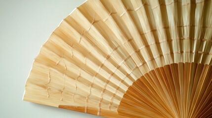 Beautiful geometric pattern in a handcrafted bamboo fan, with a realistic background that emphasizes traditional craftsmanship