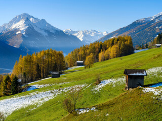 Autumn at the Telfer Wiesen in the valley Stubai, Mount Habicht and the glaciers of Stubai in the background. Austria, Tyrol