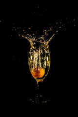 Water splash from orange drink glass