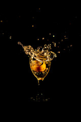 Water splash from orange drink glass