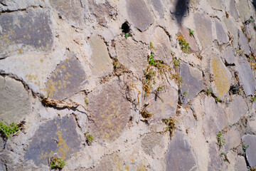 Texture and details of the house foundation. Arrangement of large stones and cement castings arranged slanted for a solid foundation. Wallpaper and backgrounds. Textured Effects photography Concepts