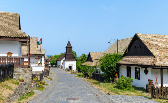 Village high street with church. The Paloc village Holloko in Hungary, listed as UNESCO World Heritage Site.