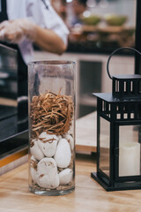 stones in a glass cup as table decoration