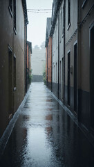 Fototapeta premium rain falling softly in quiet alley background art design backdrop
