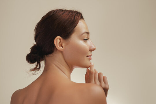 Side Profile of a Woman with Smooth Skin and Natural Beauty in Soft Lighting