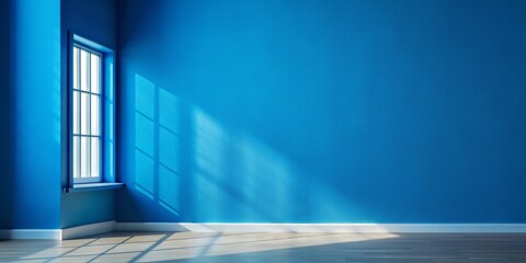 Obraz premium Minimalist blue wall with prominent shadow of window, empty painting