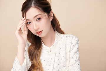 Beautiful young asian woman with clean fresh skin on beige background, Face care, Facial treatment, Cosmetology, beauty and spa, Asian women portrait.