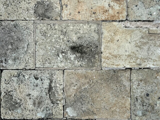 Dark grey paving stone rectangular blocks made of natural cobbles stone for outdoor pavement floors.