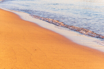 Soft wave of the sea on the sandy beach.