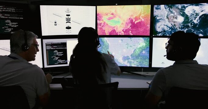People, control room and group monitor satellite maps to track storm weather pattern with back. Rocket system, engineer and launch team on computer screen with ai code, data or explore space at night