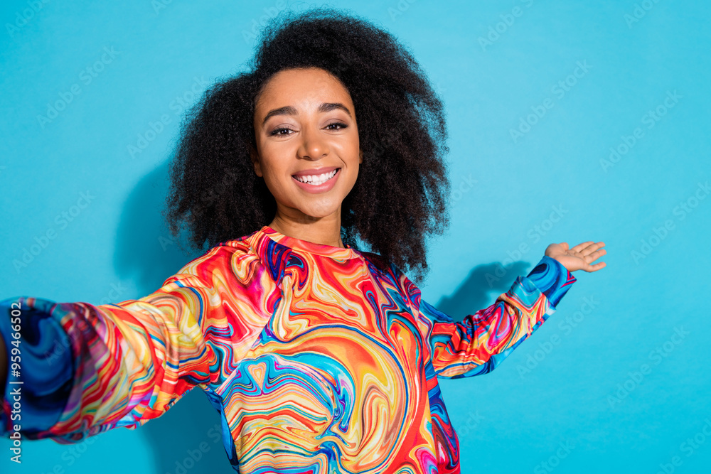 Poster Selfie photo of beautiful curly hair woman popular blogger social media content maker showing product isolated on blue color background