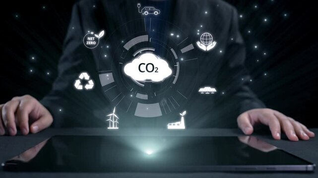 Business person implements initiatives to reduce CO2 emissions, aiming for net zero. Showcases commitment to sustainability by reducing CO2 for a greener planet. UUID