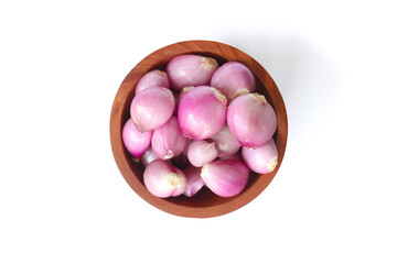 Red Onion in a wooden bowl isolated on white background.