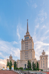 high-rise stalinist building near river at summer sunset in Moscow, Russia. Historic name is Hotel Ukraine.