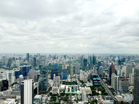 Aerial view of Bangkok skyline, Bangkok financial district, buildings and skyscrapers under sunny sky. Bangkok is the biggest and capital metropolitan city of Thailand.