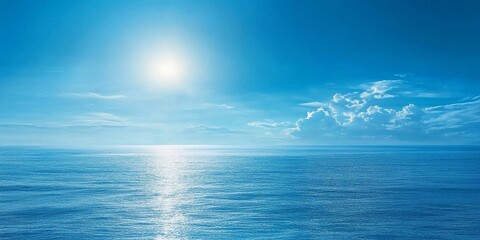 A bright, sunny day with a blue sky and clear ocean water.