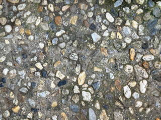 Cemented small random cut rubbles and cobble stones in various colors into cemented precast mold. 