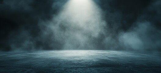 A dark, foggy background with a spotlight shining on a concrete floor.