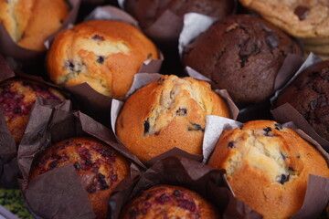 Sweet pastries with different fillings are laid out on the table.