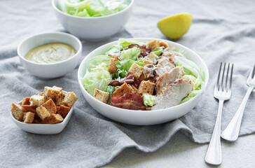 A bowl  of  Caesar salad