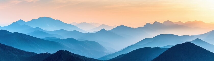 A serene landscape of layered mountains at sunset, showcasing hues of blue and orange, perfect for nature enthusiasts.