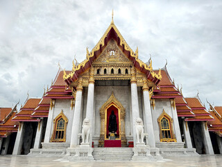 Naklejka premium Wat Benchamabophit Dusitwanaram, or commonly known as marble temple, is a famous Buddhist temple carved from white marbles at Dusit District, Bangkok, Thailand.