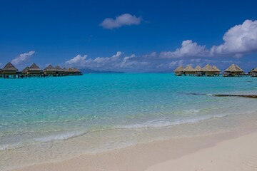 Crystal clear, turquoise waters fill the lagoon of Bora Bora