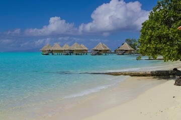 Crystal clear, turquoise waters fill the lagoon of Bora Bora