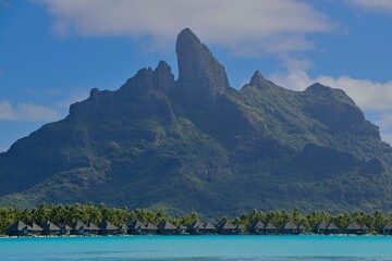 Crystal clear, turquoise waters fill the lagoon of Bora Bora