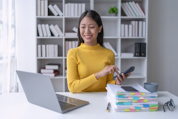woman meticulously plans a finance audit, using a computer and calculator to review budget...