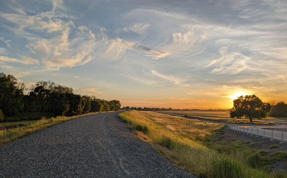 Sunset over a levee in west sacramento