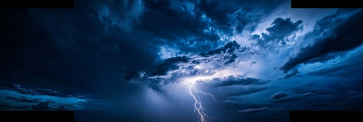 A powerful lightning bolt cuts through the ominous night sky, illuminating the clouds with its striking brightness, creating a dramatic atmosphere of a thunderstorm