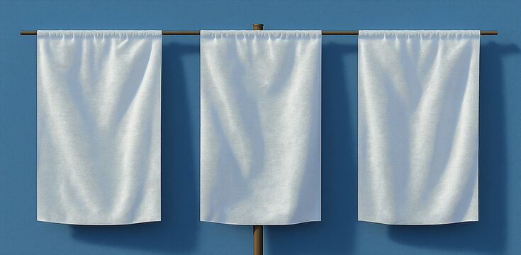 Three white fabric banners hanging on poles in front of textured dark wall