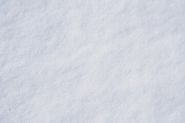 The natural texture of snow. The snow-covered land. A close-up view from above.