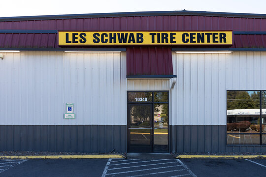 Beaverton, OR, USA - March 17, 2024 - Les Schwab tire shop center chain with it's big yellow logo signage banner. High quality picture for download