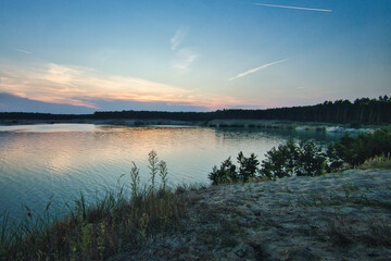 See im Abendrot - Sunset - Landscape - Beautiful Sunset scene over the lake and silhouette hills in the background - Sunrise over sea - Colorful - Reed - Clouds - Sky - Sundown - Sun	