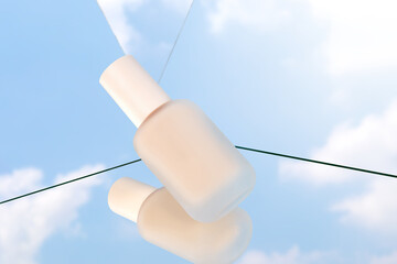 Make-up foundation product pack shot photography with sky background reflection on mirrors