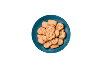 Delicious fresh sweet crispy butter cookies on a dark background