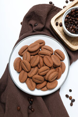 Cookies with coffee beans on a light background