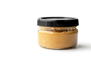 peanut butter in glass jar with black plastic lid on white background. Generative Ai