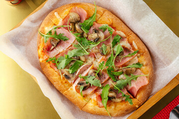 homemade pizza with meat, cheese and sauce