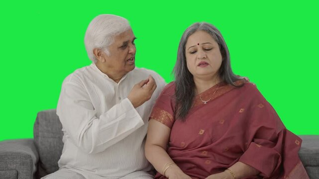 Guilty Old Indian husband apologizing to his wife Green screen