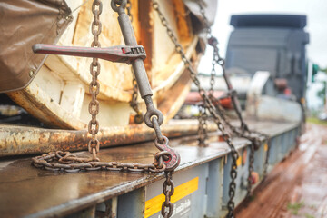 Steel chain and hook securing anchor, using to secure heavy object that transported on the trailer...