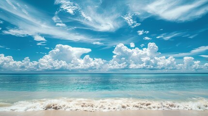 Obraz premium Beautiful tropical empty beach sea ocean with white cloud on blue sky background