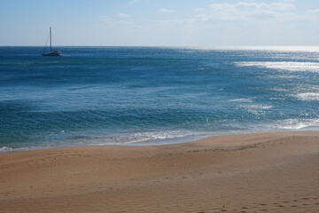 winter sea and boat in the sunlight